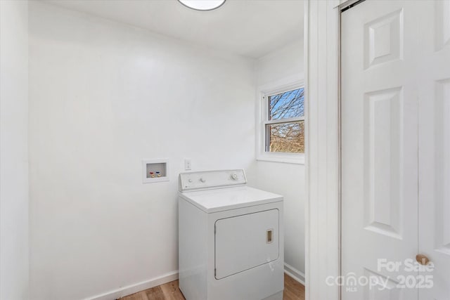 laundry room with washer / clothes dryer and light wood-type flooring