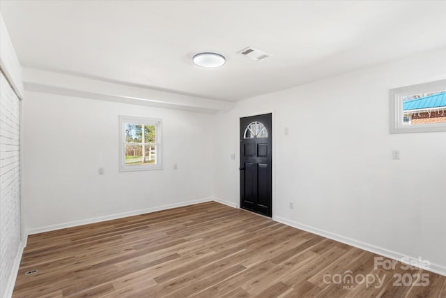 spare room featuring hardwood / wood-style floors