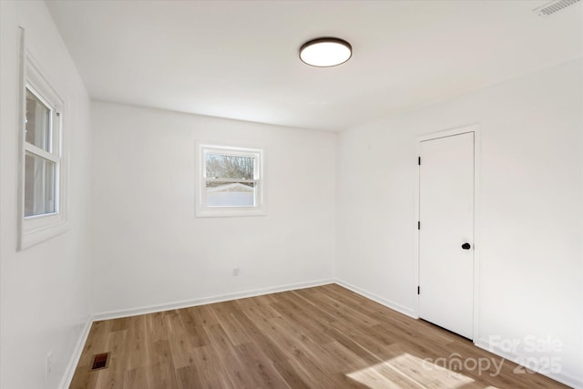 empty room featuring light hardwood / wood-style floors