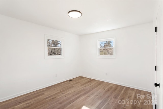 unfurnished room featuring light wood-type flooring