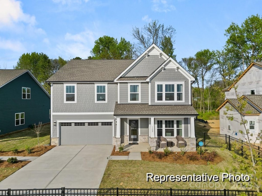 craftsman house featuring a garage and covered porch