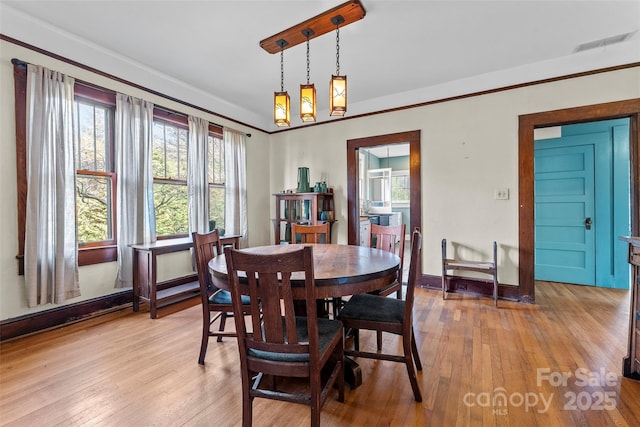 dining room with light hardwood / wood-style floors