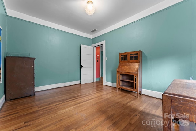 unfurnished bedroom featuring hardwood / wood-style floors