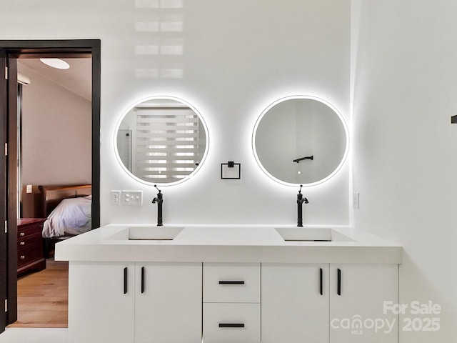 bathroom featuring vanity and hardwood / wood-style flooring