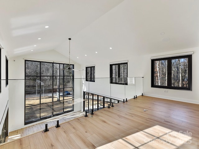 interior space featuring lofted ceiling and hardwood / wood-style floors