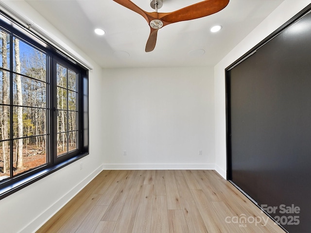 unfurnished room with light hardwood / wood-style flooring and ceiling fan