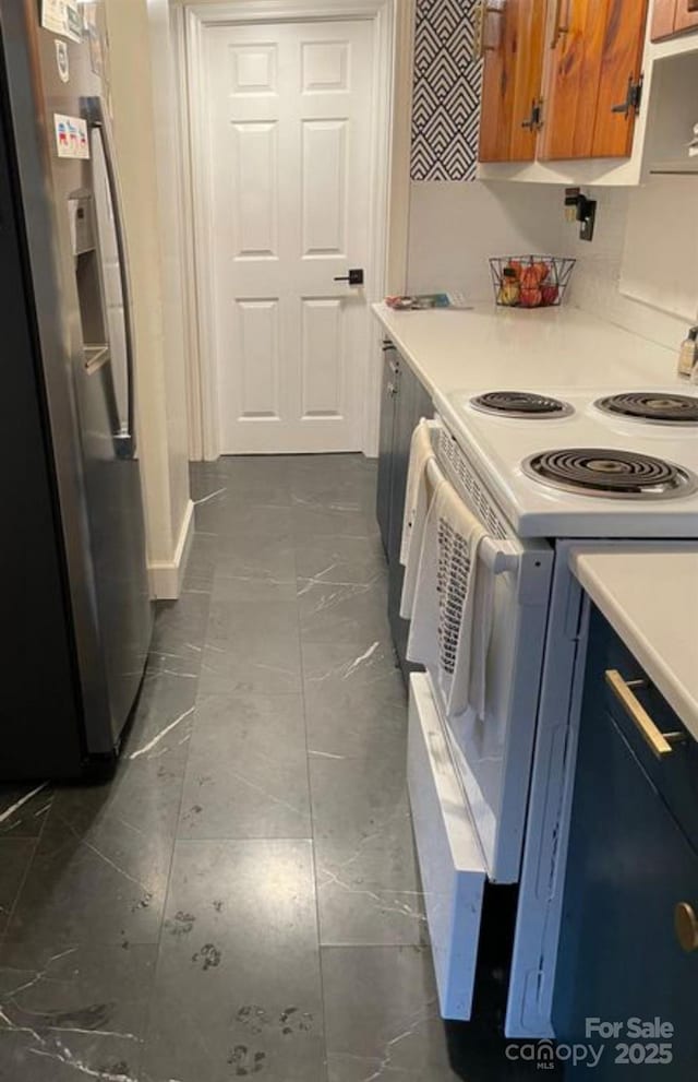 kitchen featuring white electric range and stainless steel fridge with ice dispenser