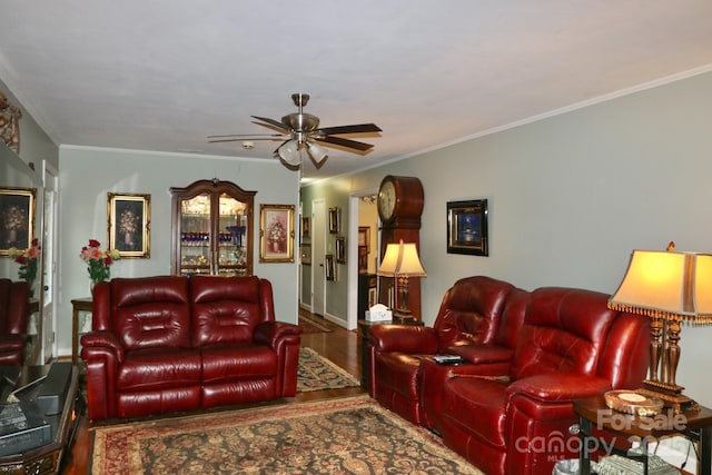 living room featuring crown molding, hardwood / wood-style floors, and ceiling fan