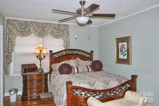 bedroom featuring crown molding, ceiling fan, hardwood / wood-style floors, and a textured ceiling