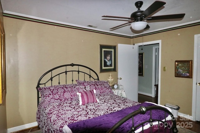 bedroom featuring crown molding and ceiling fan