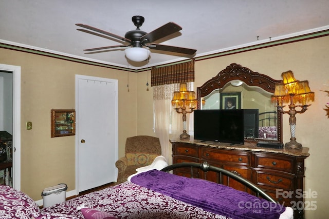 bedroom featuring ornamental molding and ceiling fan