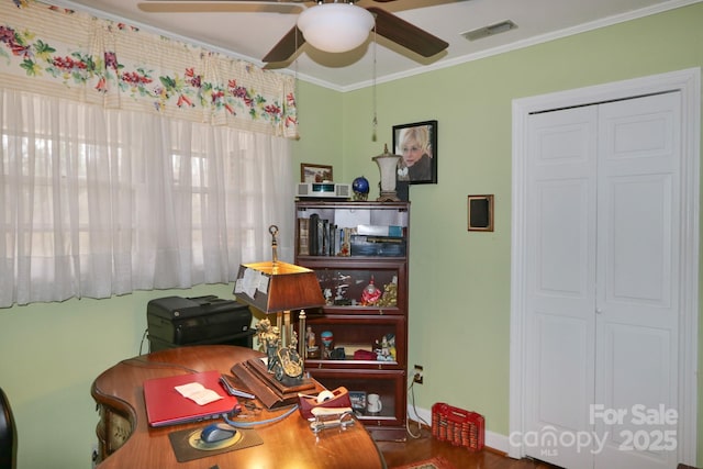 office with ornamental molding and ceiling fan