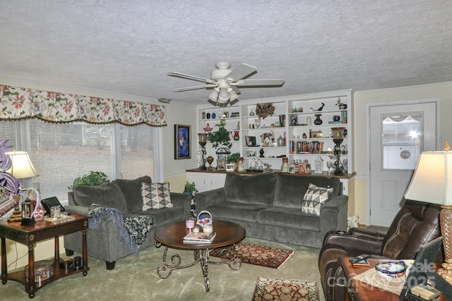 carpeted living room with ceiling fan, a textured ceiling, and built in features