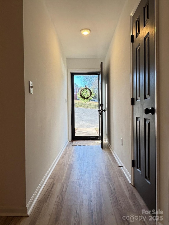 entryway with hardwood / wood-style flooring