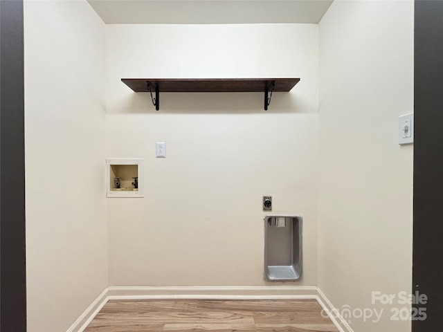 clothes washing area featuring washer hookup, hookup for an electric dryer, and wood-type flooring