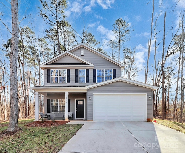 view of front of home with a garage and covered porch