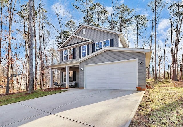 front of property with a garage and a porch