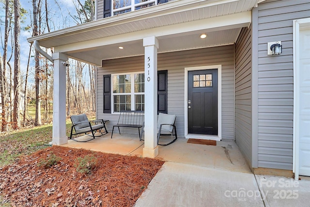 entrance to property featuring a porch