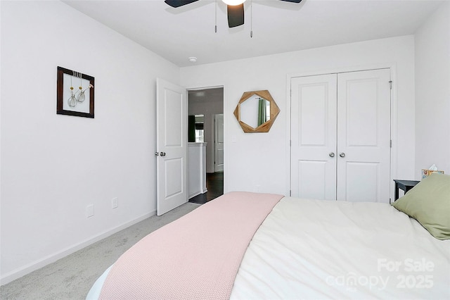 bedroom with carpet floors, ceiling fan, and a closet