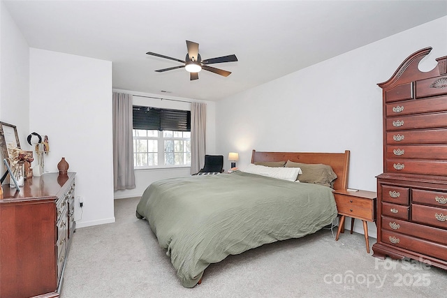 bedroom featuring light carpet and ceiling fan