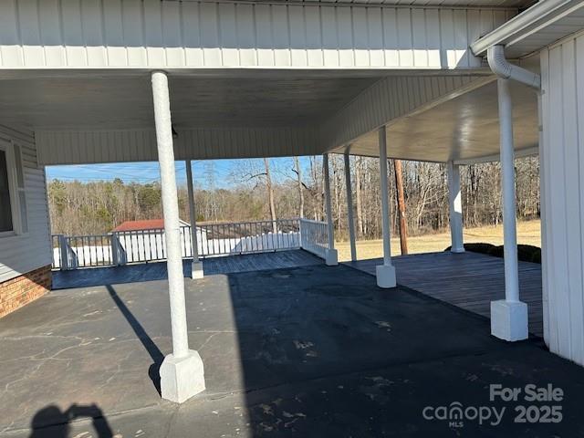 view of patio / terrace featuring a carport