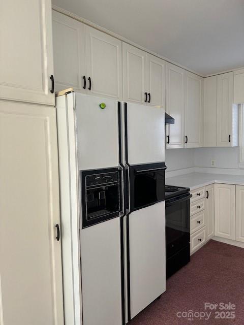 kitchen featuring white cabinetry, black / electric stove, white refrigerator with ice dispenser, dark carpet, and range hood