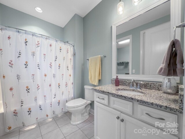 full bathroom featuring shower / bathtub combination with curtain, vanity, toilet, and tile patterned flooring