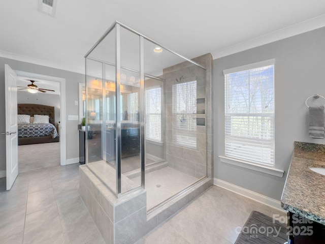 bathroom featuring vanity, tile patterned flooring, ornamental molding, and a shower with door