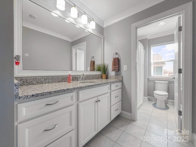 bathroom featuring vanity, tile patterned flooring, crown molding, and toilet