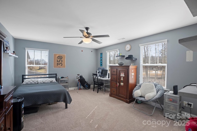 carpeted bedroom with ceiling fan