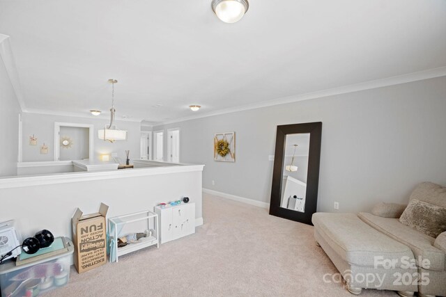 sitting room featuring ornamental molding and light carpet