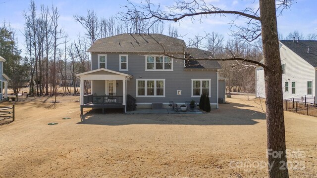 back of house featuring a patio area and covered porch