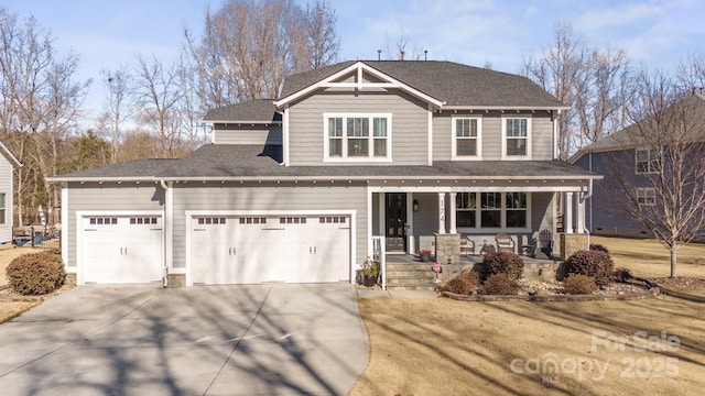 view of front of property with a garage and covered porch