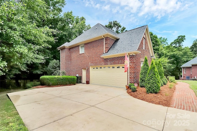 view of side of property featuring a garage