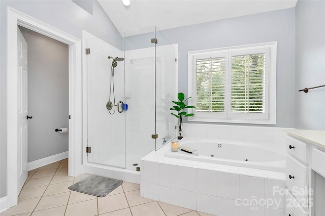 bathroom with lofted ceiling, shower with separate bathtub, tile patterned flooring, and vanity