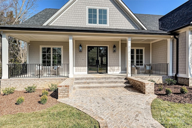 view of exterior entry featuring a porch