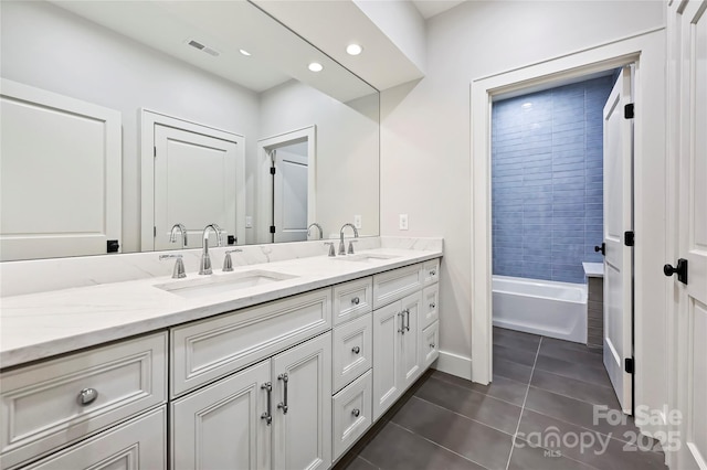 bathroom with tile patterned floors and vanity