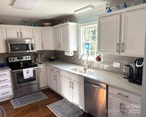 kitchen featuring white cabinetry, sink, and stainless steel appliances