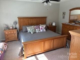 bedroom with light colored carpet and ceiling fan