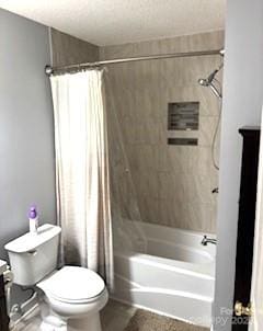 full bathroom with vanity, shower / bath combination with curtain, and toilet