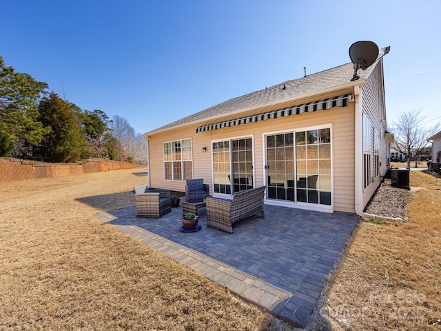 rear view of house featuring a patio area and fence