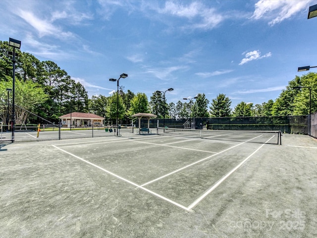 view of sport court with fence