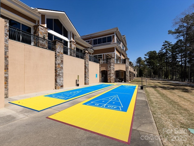 view of community featuring shuffleboard