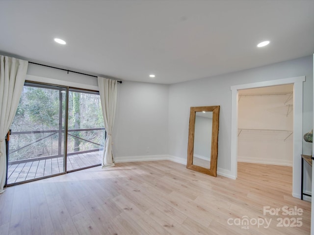 unfurnished room featuring light hardwood / wood-style floors