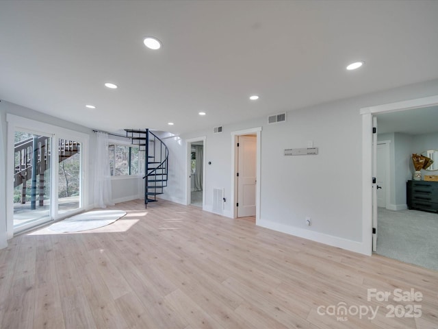 workout room with light wood-type flooring