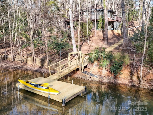 dock area featuring a water view