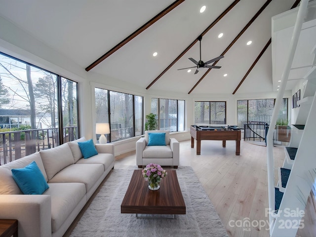 living room featuring high vaulted ceiling, billiards, ceiling fan, light hardwood / wood-style floors, and beam ceiling