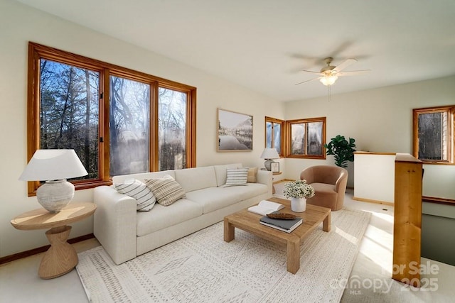 living room featuring light carpet and ceiling fan