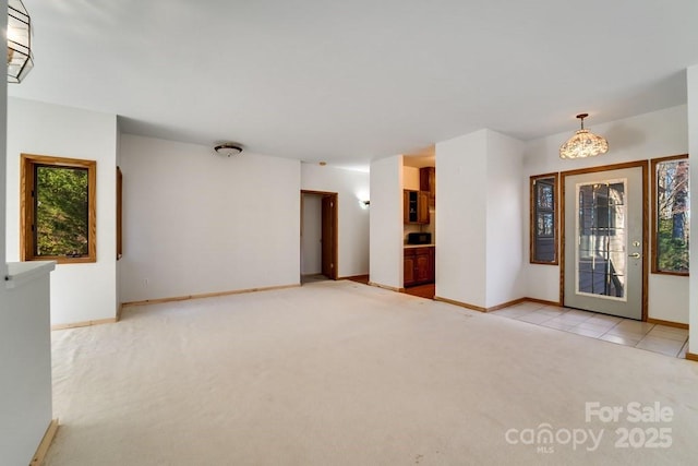 foyer entrance with light carpet