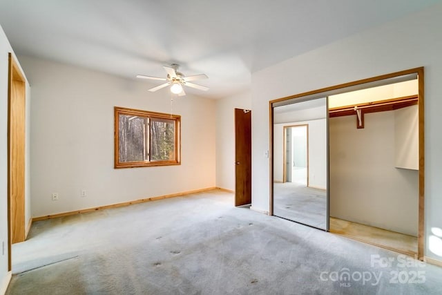 unfurnished bedroom with light colored carpet, ceiling fan, and a closet